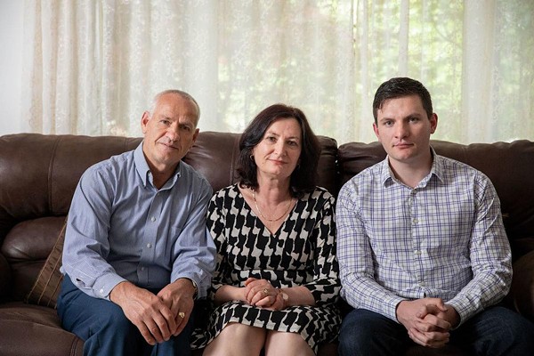 Rustem Kazazi, left, sits at home with wife, Lejla, and son Erald in Parma Heights, Ohio. - Courtesy of Institute for Justice