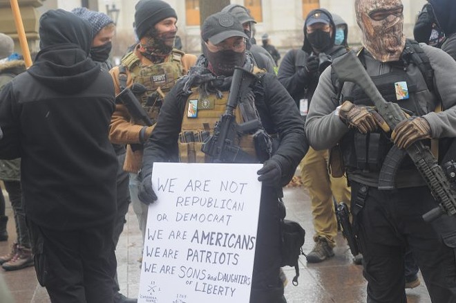 Armed men identifying themselves with the Boogaloo Movement stand outside the Ohio Capitol Jan. 17. Photo by Jake Zuckerman/OCJ. - OHIO CAPITAL JOURNAL