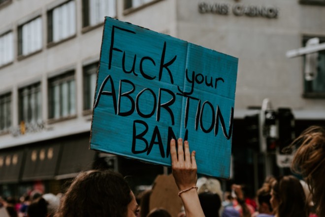 A sign at an abortion rally - Claudio Schwarz, Unsplash
