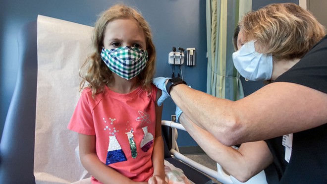 Lydia Melo, 7, gets the first of two Pfizer COVID-19 vaccinations on September 28, 2021, as part of the vaccine’s clinical trial hosted at Duke University. FDA authorized the vaccine for 5- to 11-year-olds on October 29. - SHAWN ROCCO/DUKE HEALTH