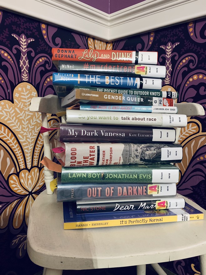 The stack of challenged/banned books Ariel Hakim is currently reading. - COURTESY OF ARIEL HAKIM