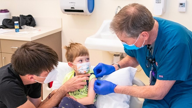 A 3-year-old gets a Pfizer COVID-19 vaccine last year in a clinical trial for children ages 6 months through 4 years. - STEVE FISCH/STANFORD MEDICINE