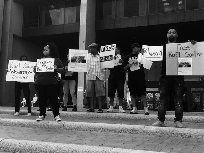 Protesters stand outside of the Justice Center before RuEl Sailor's exoneration for murder in March 2018. - ERIC SANDY / SCENE