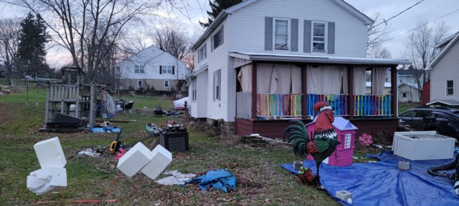 Bowman's yard on a recent January day showed some of the detritus that has neighbors upset. - MARIA ELENA SCOTT