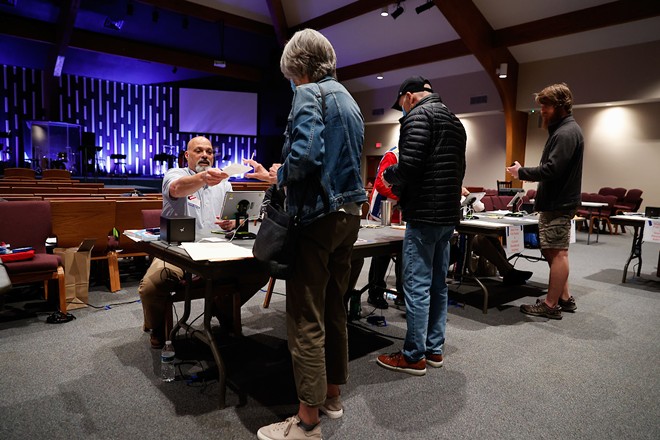 Roster judge Jeff Greenberg checks a voter during the Ohio primary election, May 3, 2022, at the Grace Life Nazarene Church voting location, New Albany, Ohio. - (Photo by Graham Stokes.)