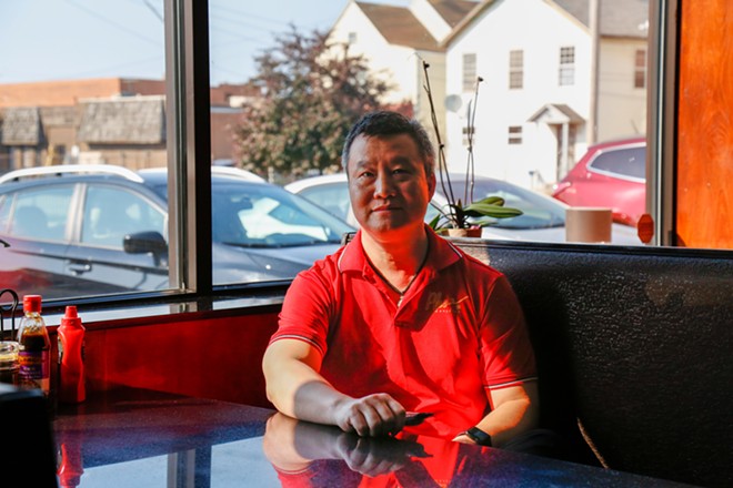 Thomas Mei, the owner of Pho Sunshine, in early June. Mei's in full support of seeing Mr. Huang's blueprints for a Chinese-style gate erected on East 21st, along with an accompanying historical marker in front of Emperor's Palace. - Mark Oprea