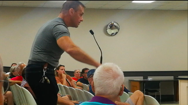 Kevin Stanley, a Fairview resident on West 227th, speaks at Monday's meeting. "If I talk to another neighbor that has poop flowing in their basement...," he said. - Chris Reed