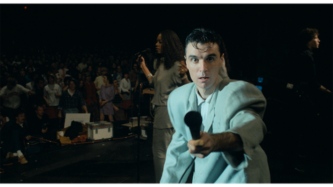 David Byrne in the rare suit that absolutely deserves the adjective “iconic.” - JORDEN CRONEWETH. COURTESY OF A24