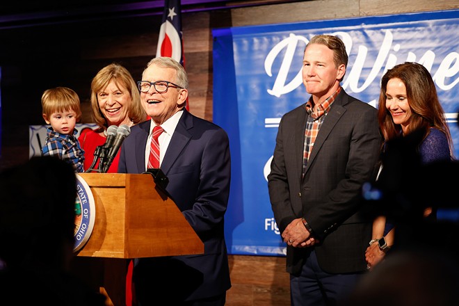 COLUMBUS, OH — MAY 03: Ohio Gov. Mike DeWine joined on stage by First Lady Fran DeWine, grandson Calvin, Lt. Gov. Jon Husted and Second Lady Tina Husted to celebrate DeWine winning the Republican Party nomination for governor in the Ohio primary election, May 3, 2022, at the DeWine-Husted campaign headquarters, Columbus, Ohio. - Photo by Graham Stokes for the Ohio Capital Journal.