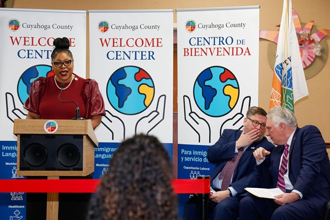 Cuyahoga County Councilwoman Meredith Turner speaking on Wednesday, next to Global Cleveland head Joe Cimperman and County Executive Chris Ronanyne. - Mark Oprea