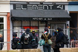 Counter-protestors outside Element 41 at a contentious drag brunch in Chardon last April. Tension between the LGBTQ community and hate groups has become more apparent in recent years. - Photo by Mark Oprea