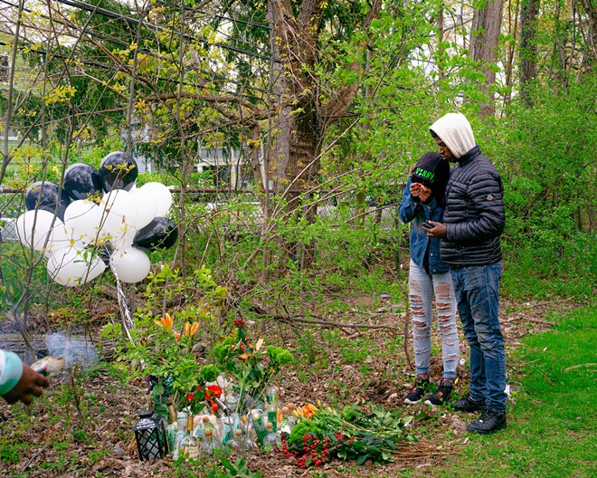 On April 20, 2021, about a dozen friends and family visited Vincent’s memorial. Diamond, alone, walked up to it and buried her face in her hands. Alondo Ivery, Vincent’s best friend, followed and put his arm around her. - Michael Indriolo for The Marshall Project