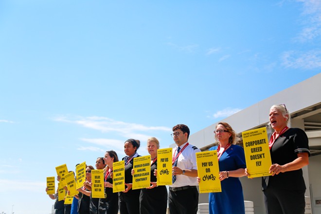 United flight attendants picket at Cleveland Hopkins on Wednesday. - Mark Oprea