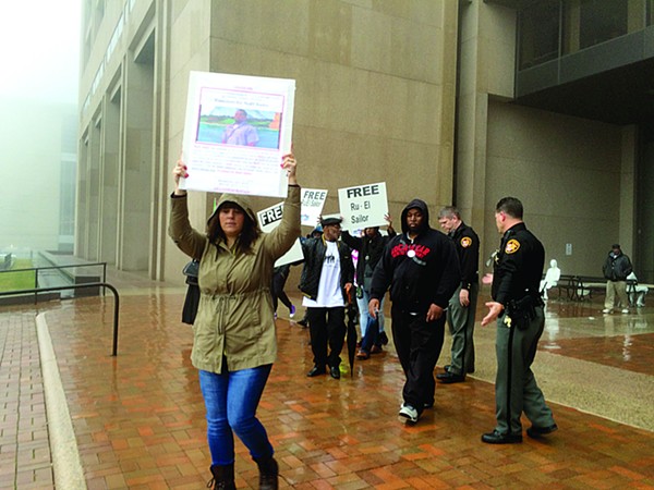 Amy Spence and others demonstrating in front of the justice center.