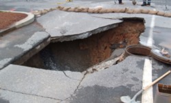 A city van recently fell into a sinkhole similar to this. - Wikimedia Commons