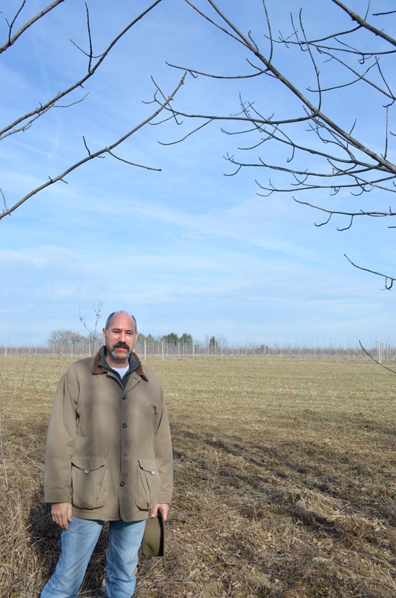 Jon Strong stands in the middle of the proposed Nexus route on his property in Guilford Township, Ohio.