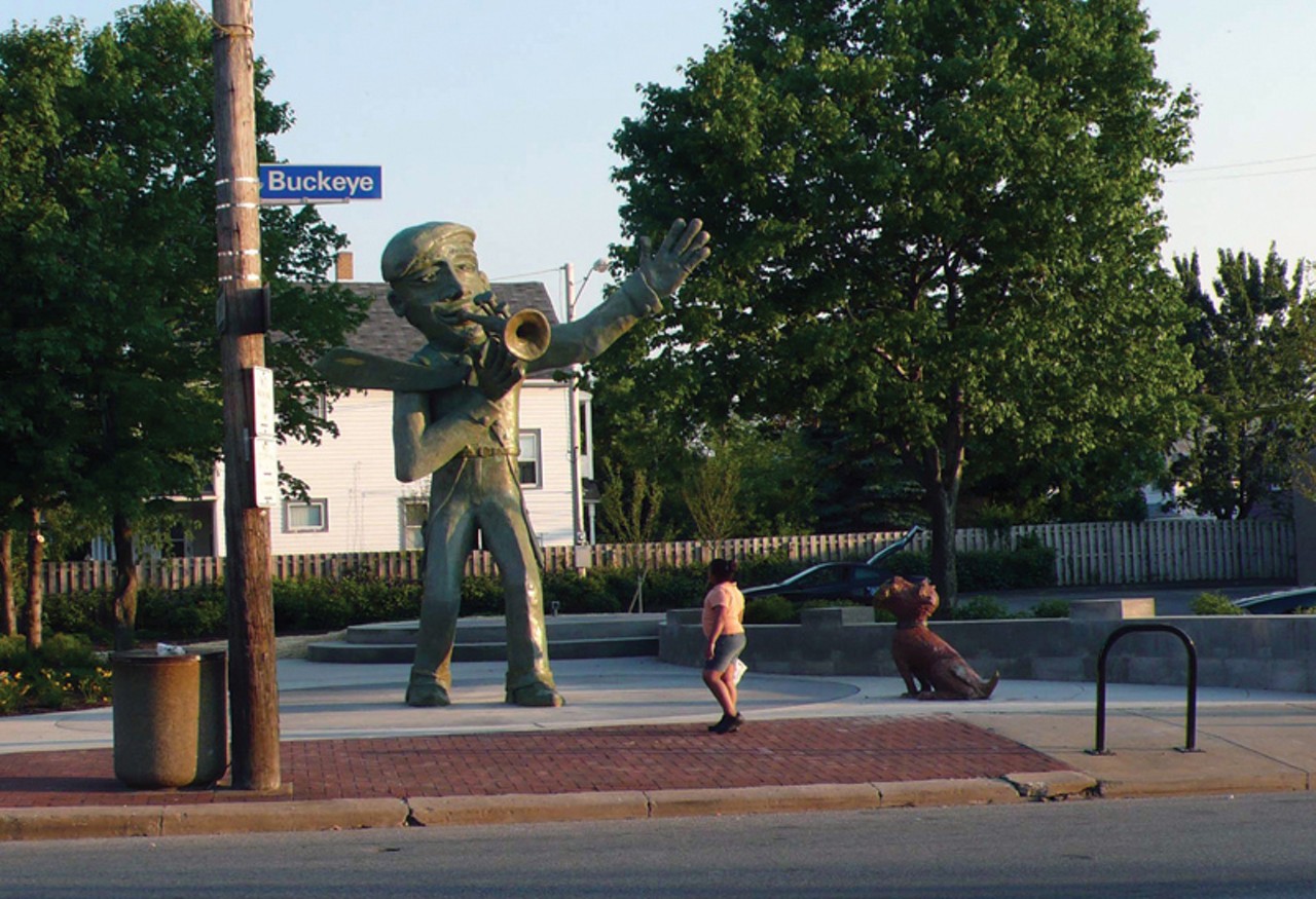 Buckeye Trumpet Man and Dog
2851 East 118th St., Cleveland
In the heart of the Buckeye neighborhood, this 16-feet, concrete statue portrays a man playing trumpet as his dog looks up in admiration from below. It was installed as part of a project that converted a parking lot into a pocket park plaza, where the annual Buckeye Jazz Festival is held. 
Photo via WikimediaCommons