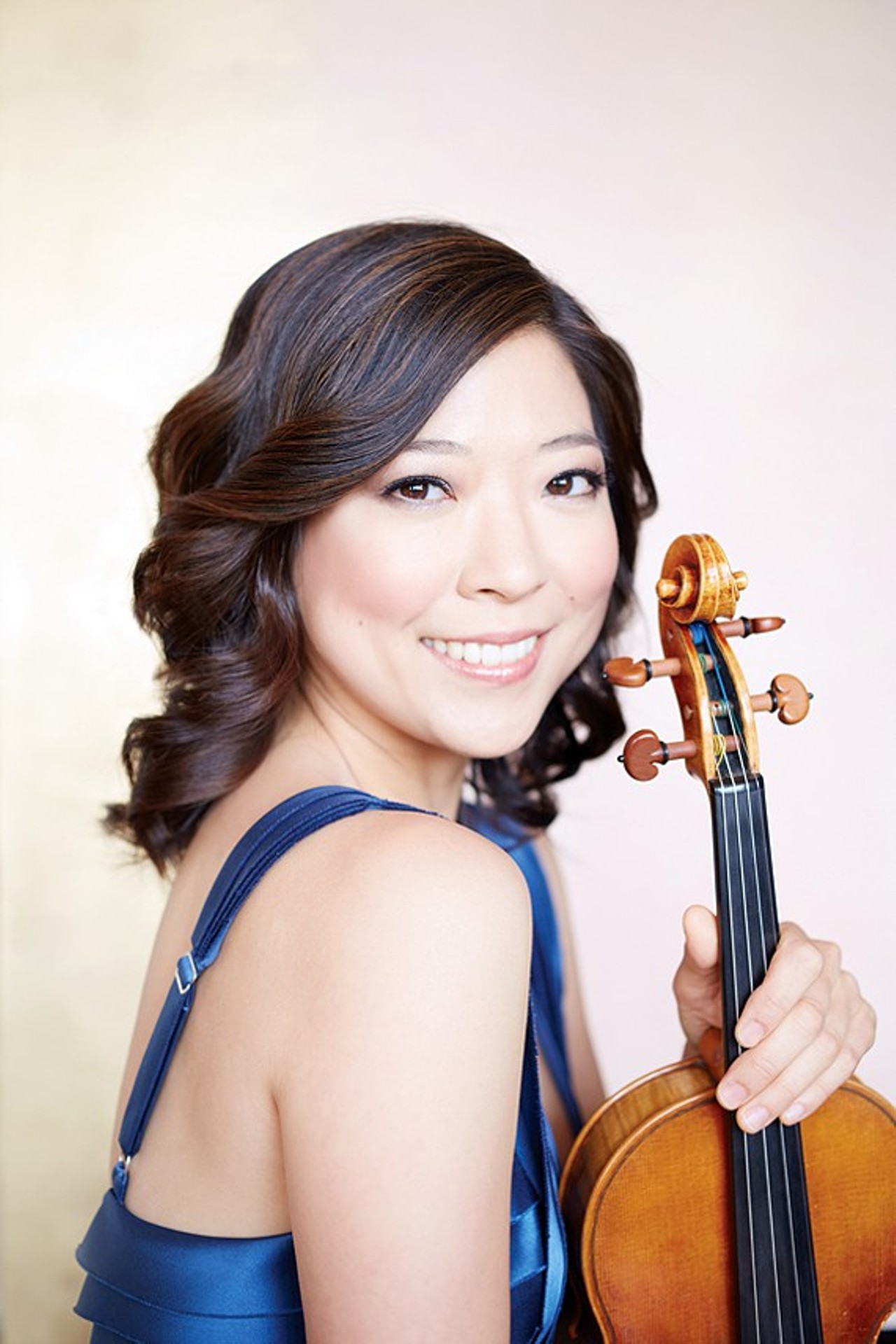 The Classical Ambassador: Amy LeeViolinist, Cleveland Orchestra; Member, Ensemble HD
Amy Lee was only 12 when she decided that the violin should be something more than a hobby in her life.
"That's when I decided this is what I wanted to do; I totally fell in love. I wanted to become a violinist," says Lee, now the associate concertmaster of the Cleveland Orchestra. So she asked her parents if they'd move from Korea to the Philadelphia area so she could be around the music conservatories there. The very next year they made the move. In short time, Lee won a competition and soloed with the Philadelphia Orchestra &#150; at the tender age of 15. At 16, she enrolled at the prestigious Curtis Institute of Music. After her bachelor's there, she got her master's degree at the Julliard School in Manhattan.
"Right when I was finishing up my grad school, and started looking around for what positions were available, this was one of them," she said. "I came here totally not expecting to win such a great position out of school, but they were so nice and gave me a chance."
Soon after arriving to Cleveland in 2008, she met her future husband, the orchestra's principal oboe player, Frank Rosenwein. They married in 2012.
Together, they'd excel on stage and in front of packed crowds at Severance Hall and New York and across Europe, but they'd also take part in fun side projects, like the Ensemble HD, an idea born by principal flutist Josh Smith and the Happy Dog's Sean Watterson. The idea was simple: A small group from the orchestra would perform at the westside bar.
"We thought, look, let's connect with these people who would otherwise never get to hear what we do, and let's show them that this is something they can enjoy as much as other genres of music," says Lee. "We went out there to the bar, put on a show, and it was so successful. People loved it. We were like rockstars playing Beethoven; it was so great."
Lee and Rosenwein are also part of a Cleveland-based group called PAND (Performers and Artists for Nuclear Disarmament), putting on shows to raise awareness of the dangers of nuclear weapons. They are both professors too &#151; Rosenwein at the Cleveland Institute of Music, Lee at Kent State. And Lee also performs with a group called the Omni Quartet with three other orchestra members, who also happen to be her best friends and bridesmaids.
In seven years, there are many memories, but Lee's favorite moments so far in the Cleveland Orchestra happened during European tours. "One was Rusalka, the opera by Dvorak, that we did in Salzburg. Every concert was an out-of-body experience. It was so beautiful, so amazing, and I will never forget the experience. After that, doing Brahms' Deutsches Requiem in Vienna, that was just a very special experience. The orchestra just really came together in this beautiful hall where Brahms had performed it."
From where Brahms performed his masterpiece to where you eat hot dogs and tater tots. No big deal.
By: Doug Brown