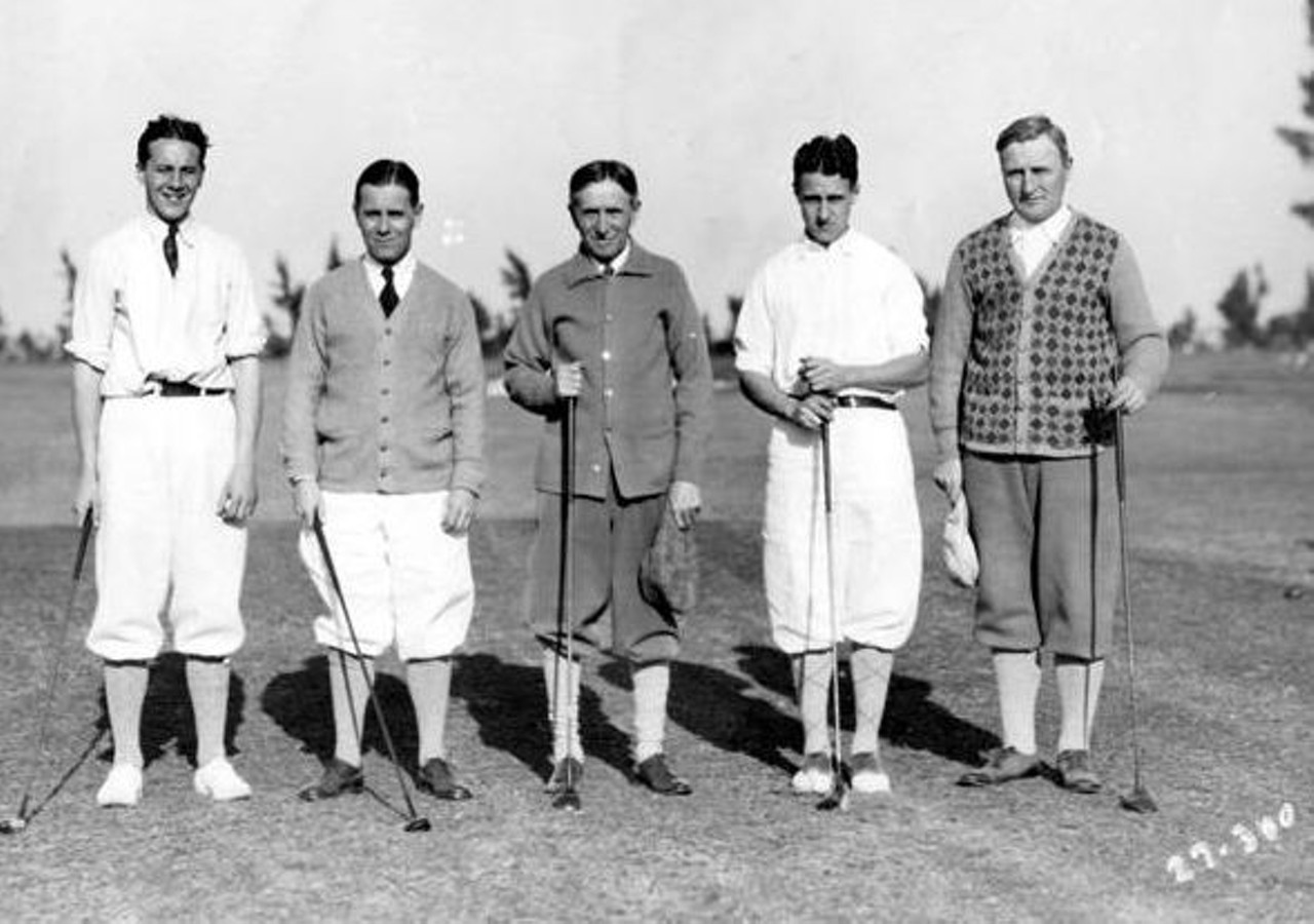 "Tire kings and future tire kings out for a round of winter golf, on the Miami Beach Bayshore Golf course. Left to right: Leonard Firestone, Harvey S. Firestone Jr., Harvey Sr., Raymond Firestone and J. W. Thomas; vice president of the Firestone Tire and Rubber Company." -- photo caption, 1927.