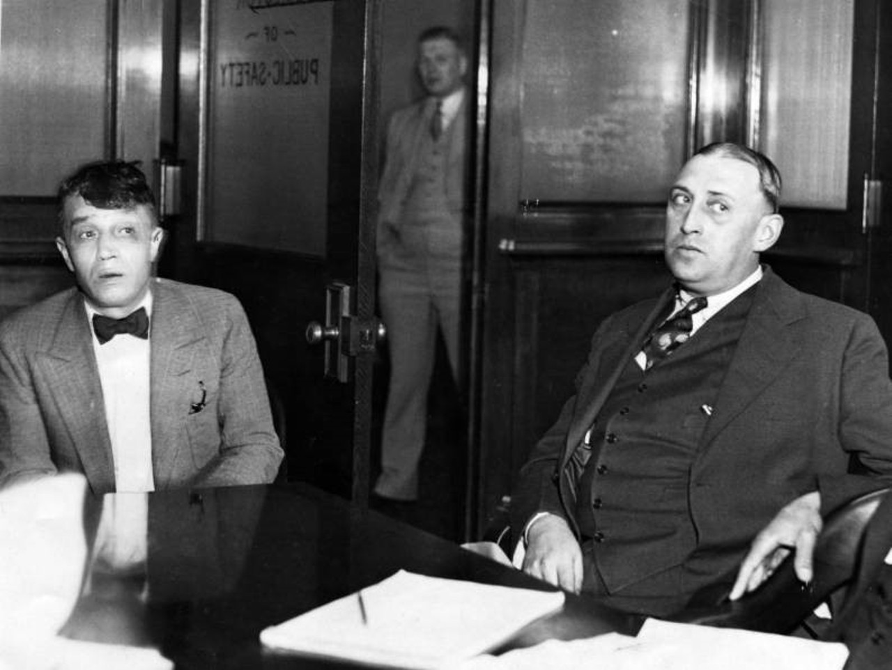 Left to right are Angelo Porrello and Walter Wingate. Porrello was a corn sugar racketeer in Cleveland who survived a prohibition clan feud in the 1920s and 1930s that saw four of his brothers die. He was later convicted of first-degree murder in the death of a former bootlegging partner, Joseph Smeraldi, who was a paroled convict. Common Pleas Judges Frank J. Merrick, Alva R. Corlett and Samuel E. Kramer did not recommend mercy for Porrello, according to a Cleveland Plain Dealer article.