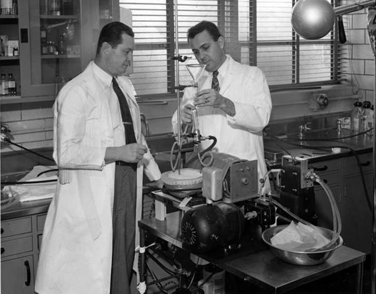  Drs. Earl B. Kay (left) and Frederick Cross of St. Luke's Hospital Adjust Their Heart-Lung Machine, 1956 