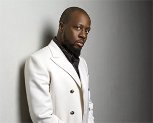 Wyclef contemplates asking Shakira for a painting or two.